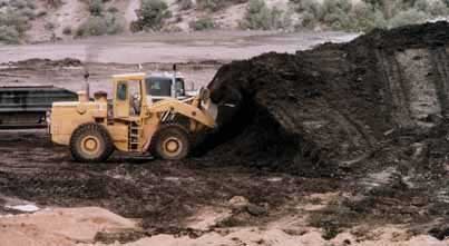 image of bulldozer moving tar sand